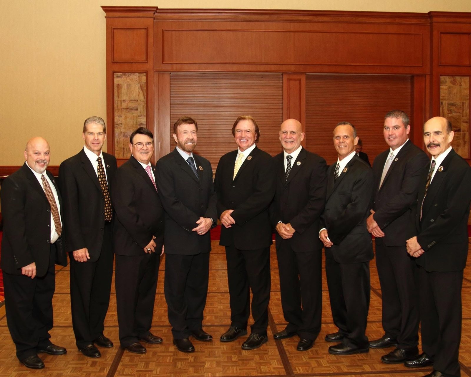 Chuck Norris System masters together at a formal UFAF gala